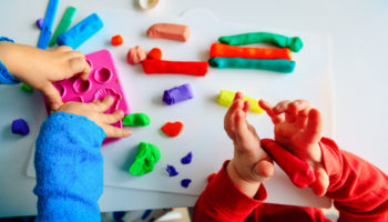 kids play with clay molding shapes, learning through play