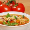 vegetable soup with tomato in the background