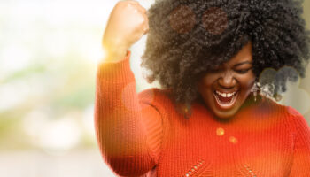 Beautiful,African,Woman,Happy,And,Excited,Expressing,Winning,Gesture.,Successful