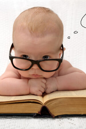 Portrait,Of,Adorable,Baby,In,Glasses,Counting,In,Mind,With