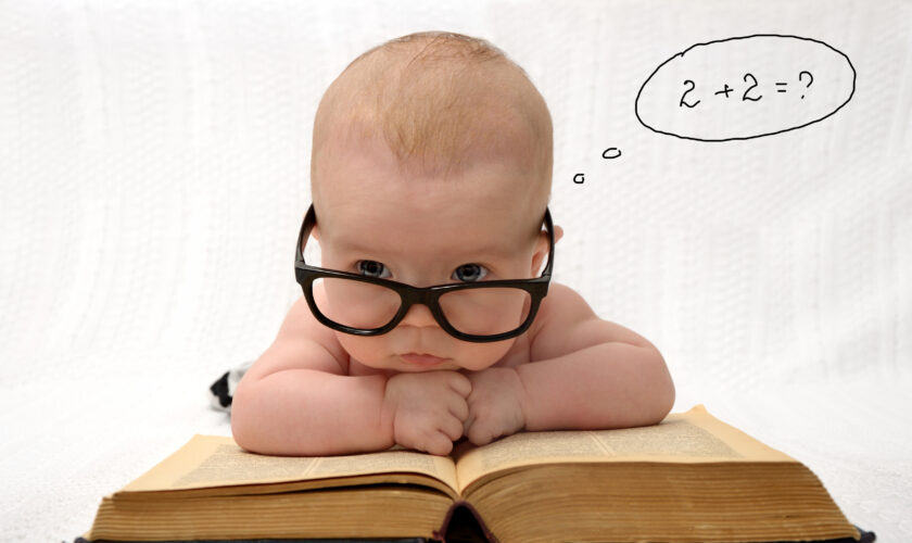 Portrait,Of,Adorable,Baby,In,Glasses,Counting,In,Mind,With