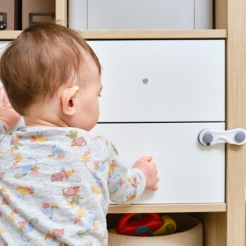 Toddler,Baby,Boy,Rips,Off,A,Cabinet,Drawer,With,His