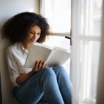 Portrait,Of,Young,Woman,With,Book,Indoors,At,Home,,Reading.