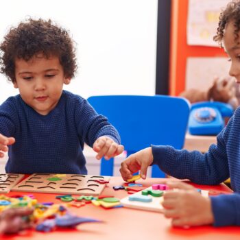 Adorable,African,American,Boys,Playing,With,Maths,Puzzle,Game,Sitting