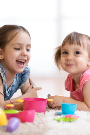 Cute,Kids,Children,Playing,With,Kitchenware,While,Lying,On,Floor