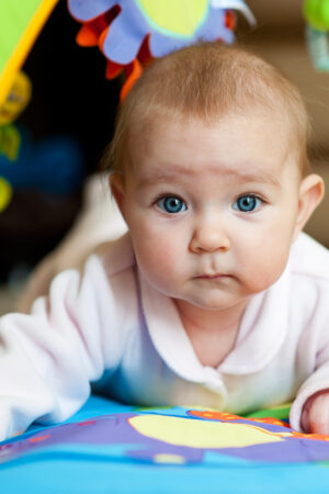 Little,Adorable,Newborn,Infant,Baby,Girl,Lying,On,Tummy,On