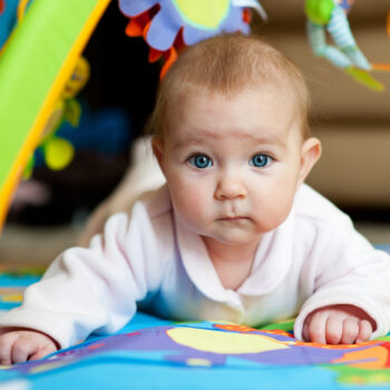 Little,Adorable,Newborn,Infant,Baby,Girl,Lying,On,Tummy,On