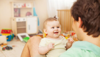 Father,With,His,Cheerful,Baby